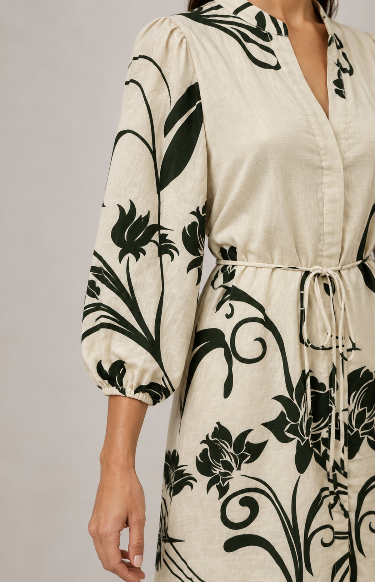 Gathered elasticated sleeve cuff of the SOGNA green floral dress 43250859-1, shown worn.