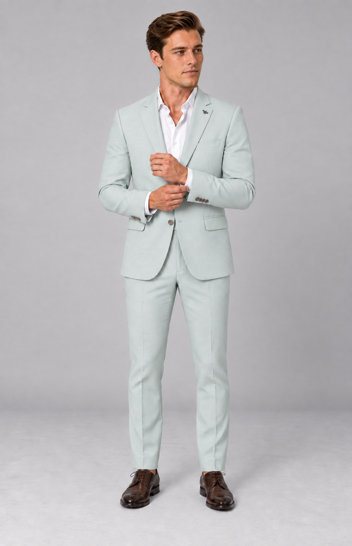 SOGNA Quinn 1907 Mint single-button suit jacket on M01, standing and adjusting a cuff. Jacket only.
