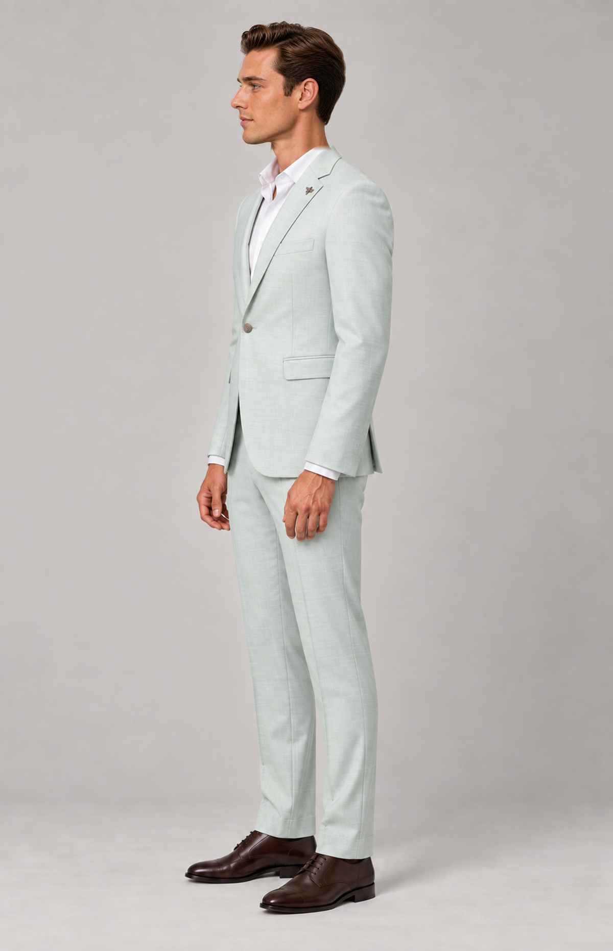 Side view of the mint Quinn 1907 suit trousers, styled with a matching jacket
