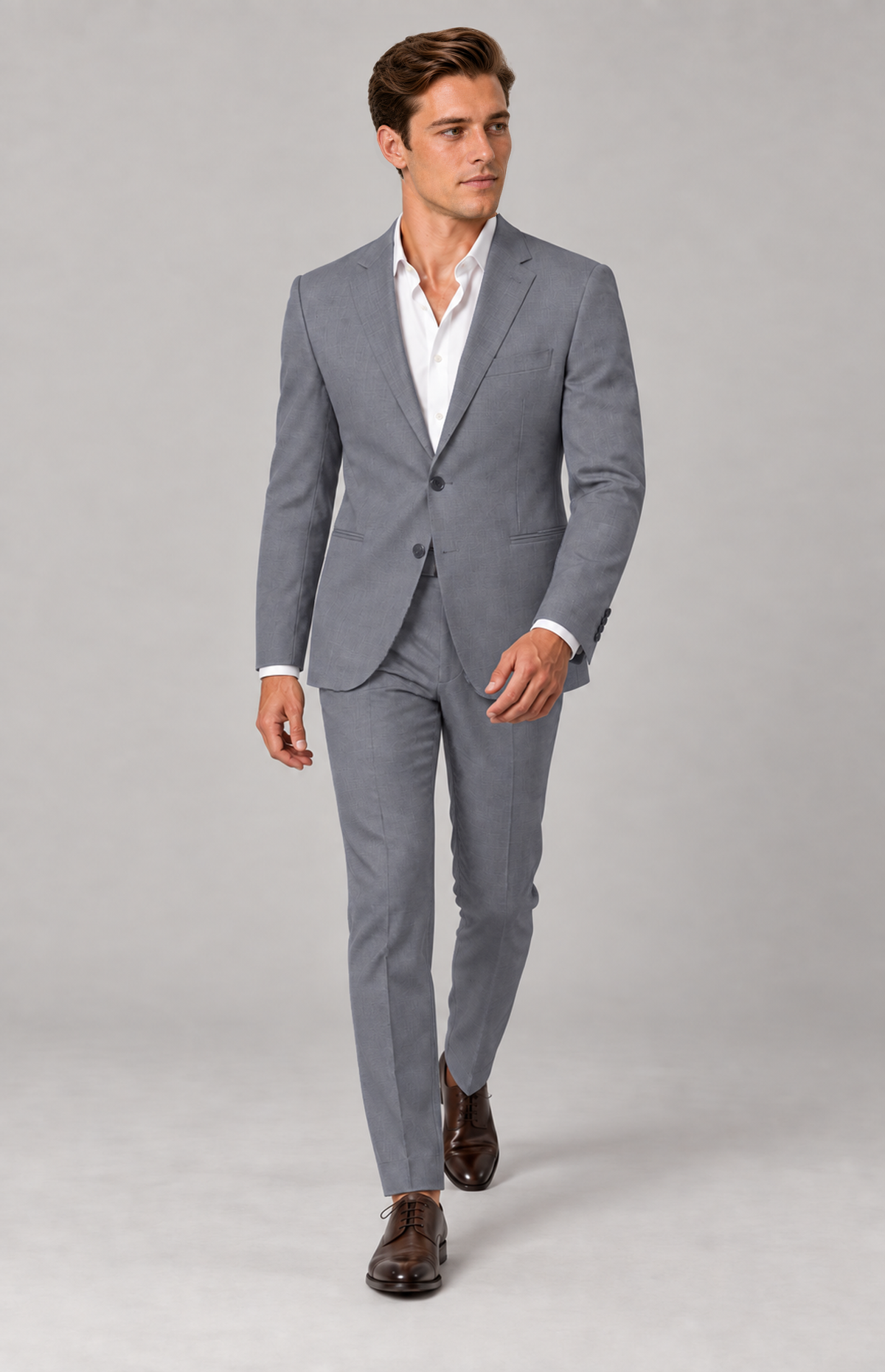 M01 wearing the grey Hudson 1985 Oxford suit, full-length walking view. Trousers only; other items are styling.