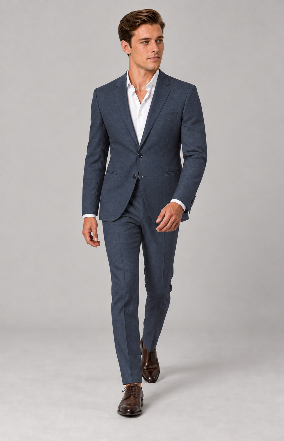 M01 wearing the navy Hudson 1985 Oxford suit, full-length walking view. Trousers only; other items are styling.
