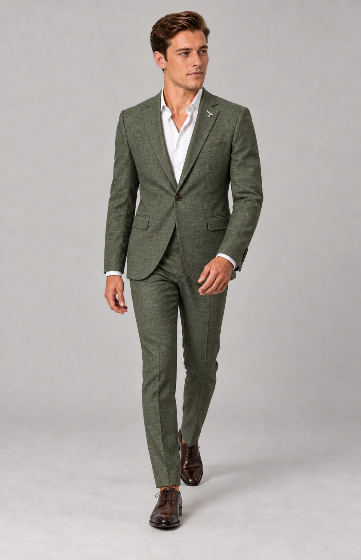 M01 wearing the moss 3061 suit, full-length walking view. Jacket only; other items are styling.