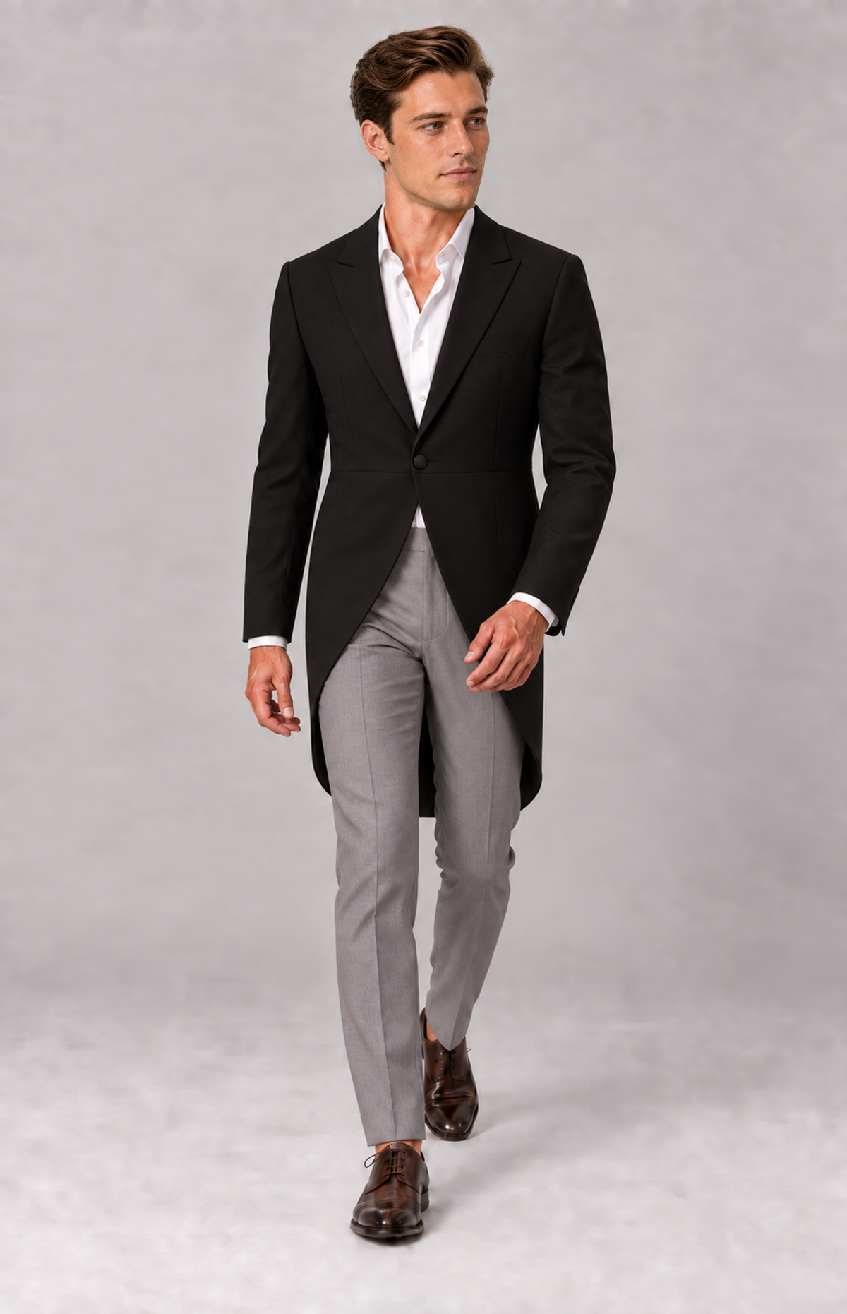 M01 wearing the black 3209 morning tails jacket, full-length walking view. Jacket only; grey trousers, shirt and shoes are styling.