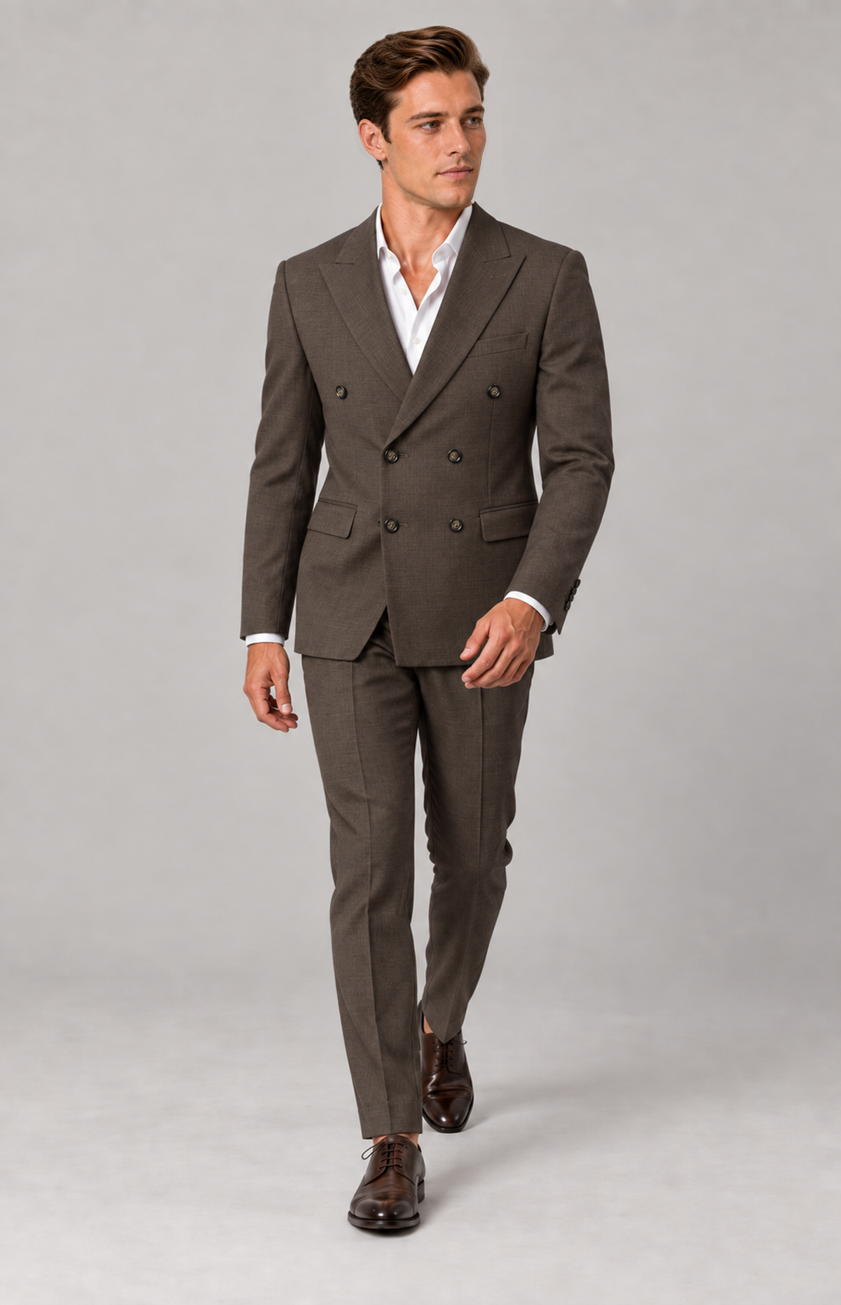 M01 wearing the tobacco double-breasted 3424DB suit jacket with coordinating trousers, full-length walking view. jacket only; other items are styling.