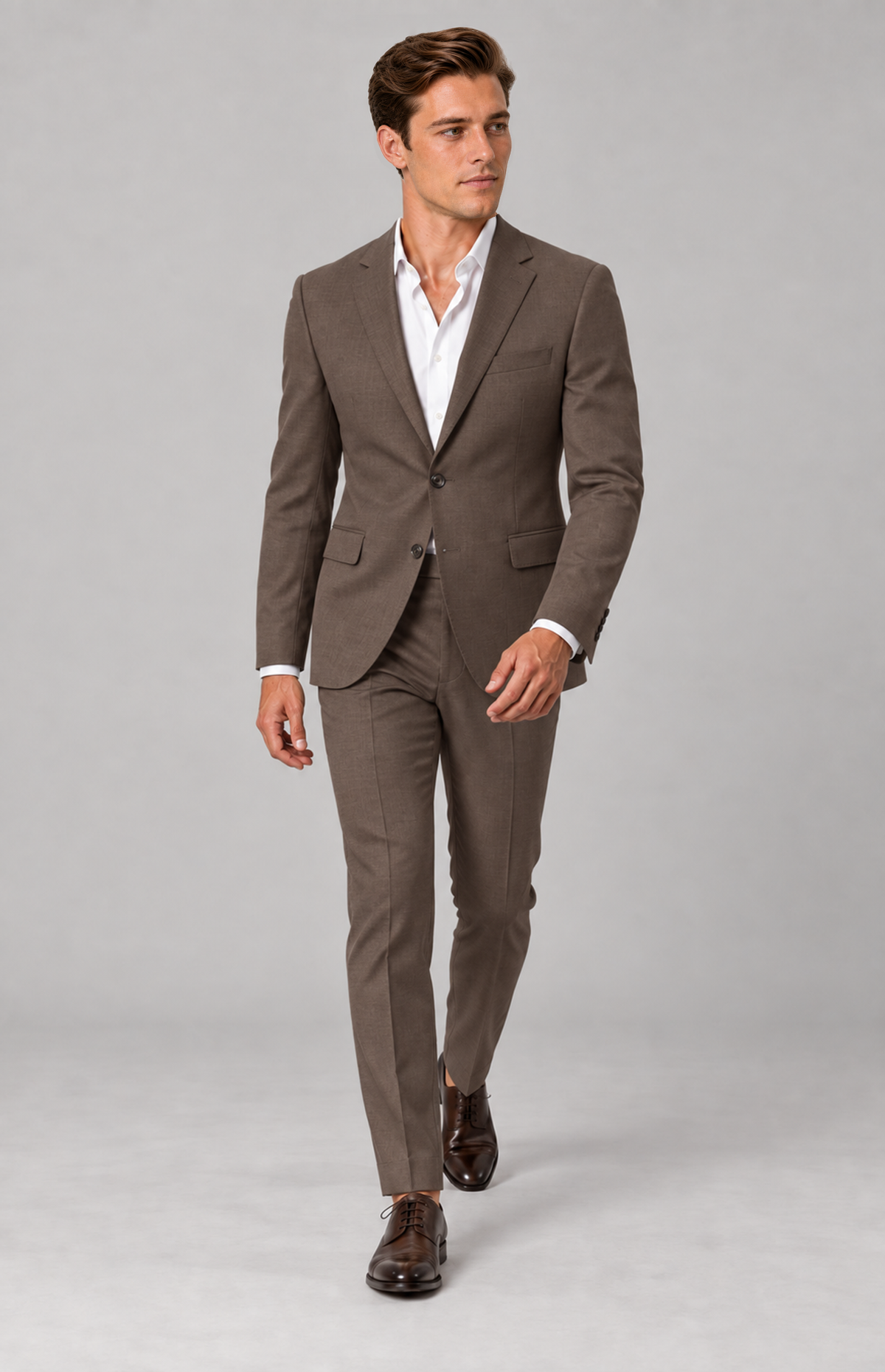 M01 wearing the tobacco single-breasted 3424 suit jacket with coordinating trousers, full-length walking view. jacket only; other items are styling.