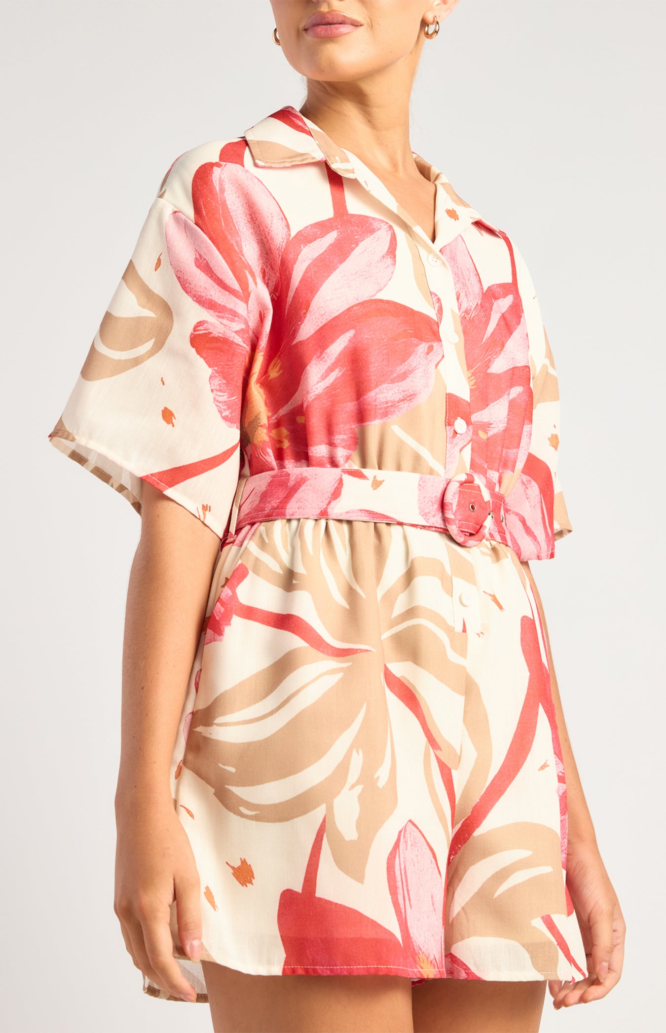 Collared button-front bodice and matching buckle belt on the Red and Camel floral playsuit