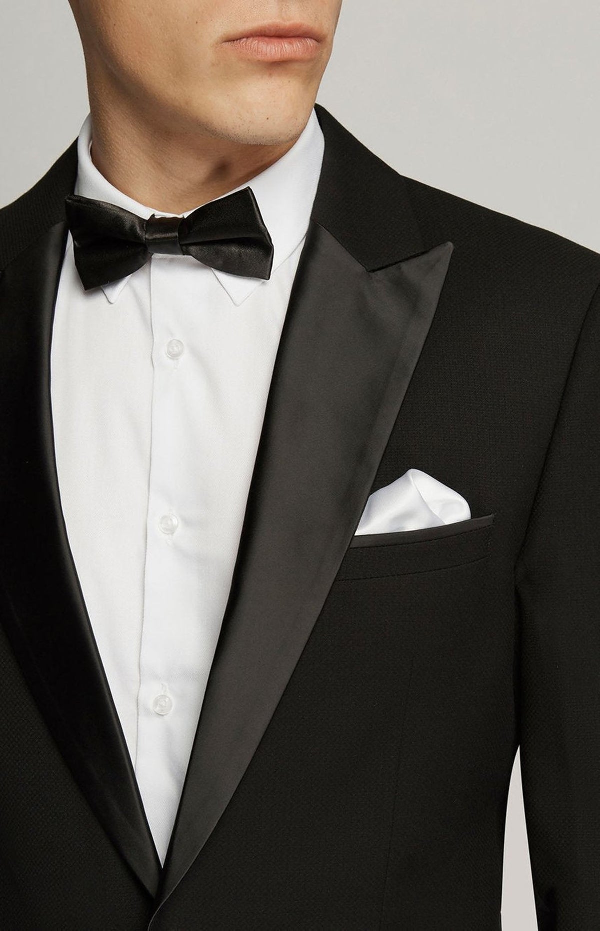Close-up of the satin lapel, bow tie and white pocket square on the Black Dinner Jacket 1303