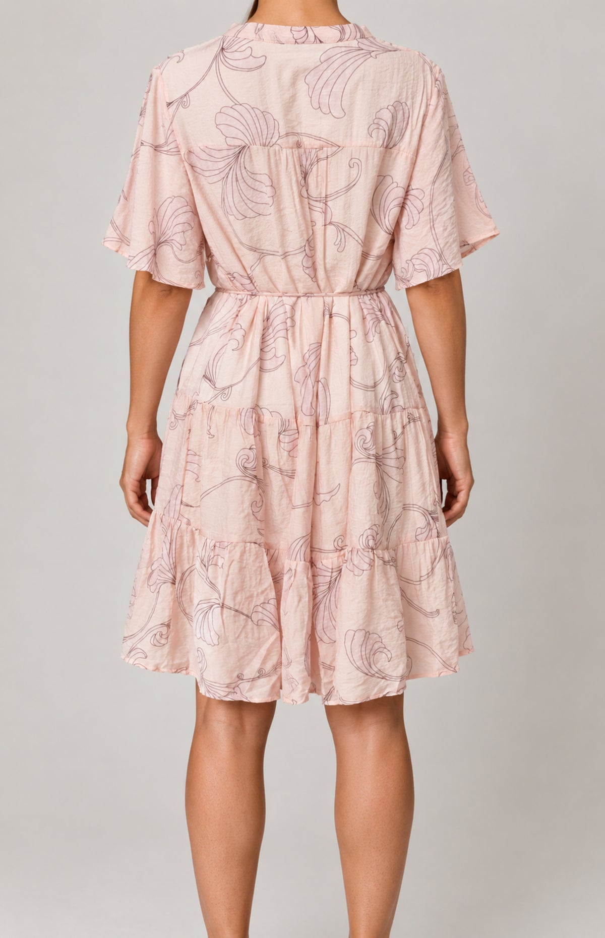 Back view of SOGNA Pink outline-print tiered dress 30250611-1 worn by a virtual model, showing the gathered back yoke and skirt tiers