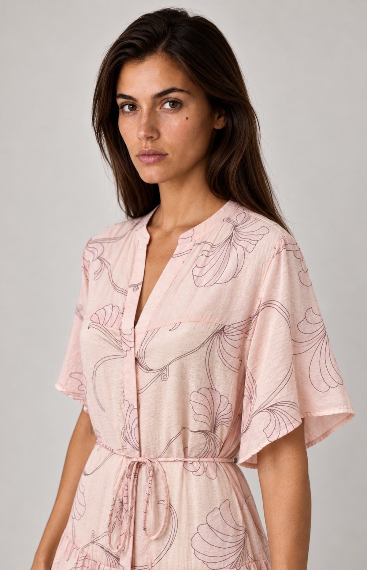 Flutter sleeve detail of SOGNA Pink dress 30250611-1 worn by virtual model W01