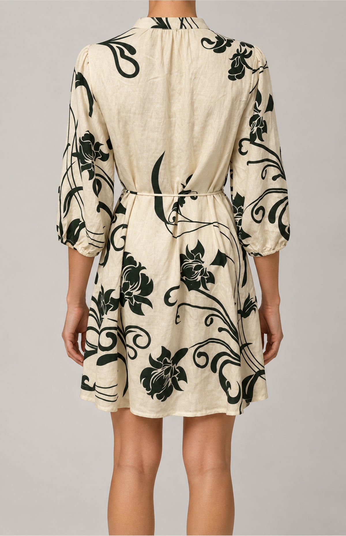 Back view of the SOGNA green floral tie-waist dress 43250859-1, shown worn.