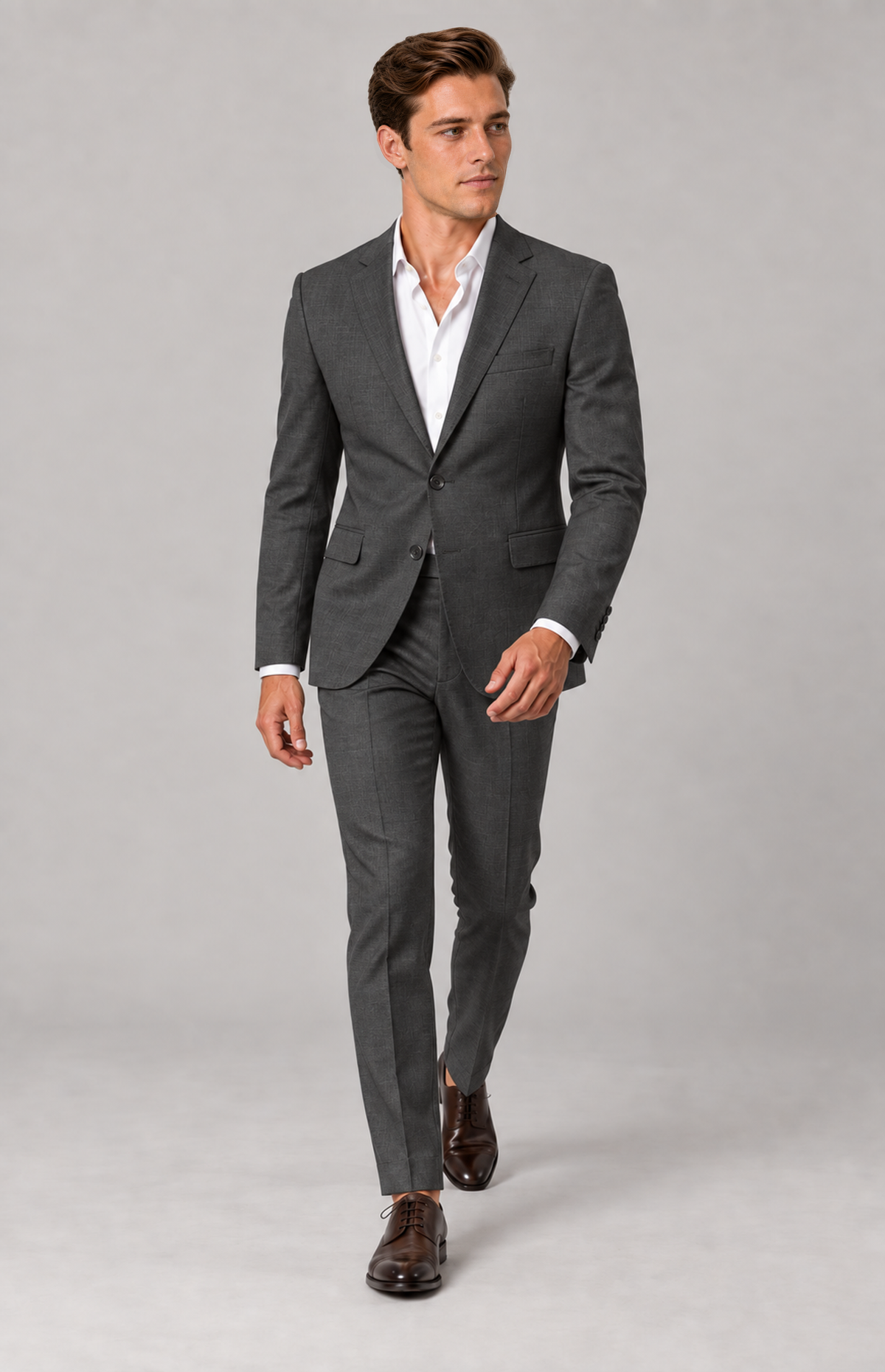 Model walking in the charcoal 22160 birdseye suit