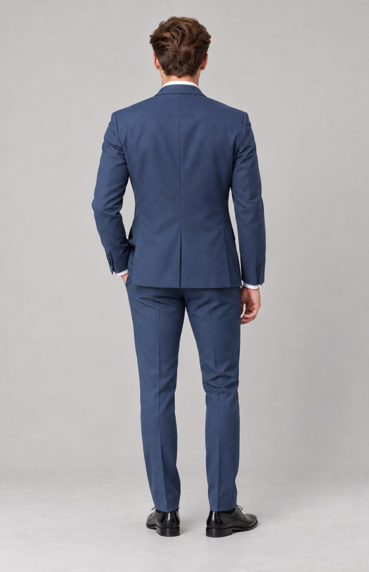 SOGNA T128 Blue tailored jacket on M01, full-length back view. Jacket only; shirt, tie, trousers and shoes are styling.