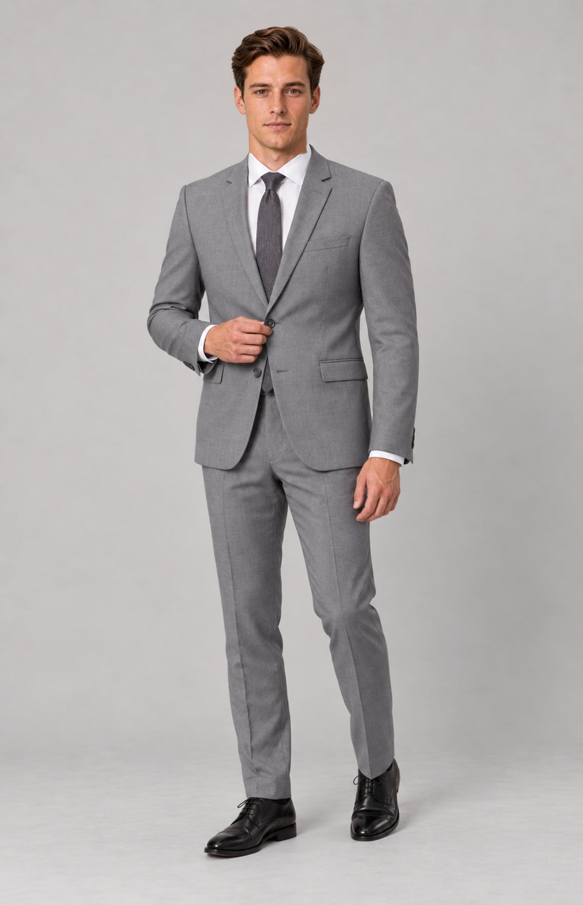SOGNA T128 Grey tailored jacket on M01, full-length natural standing pose. Jacket only; shirt, tie, trousers and shoes are styling.