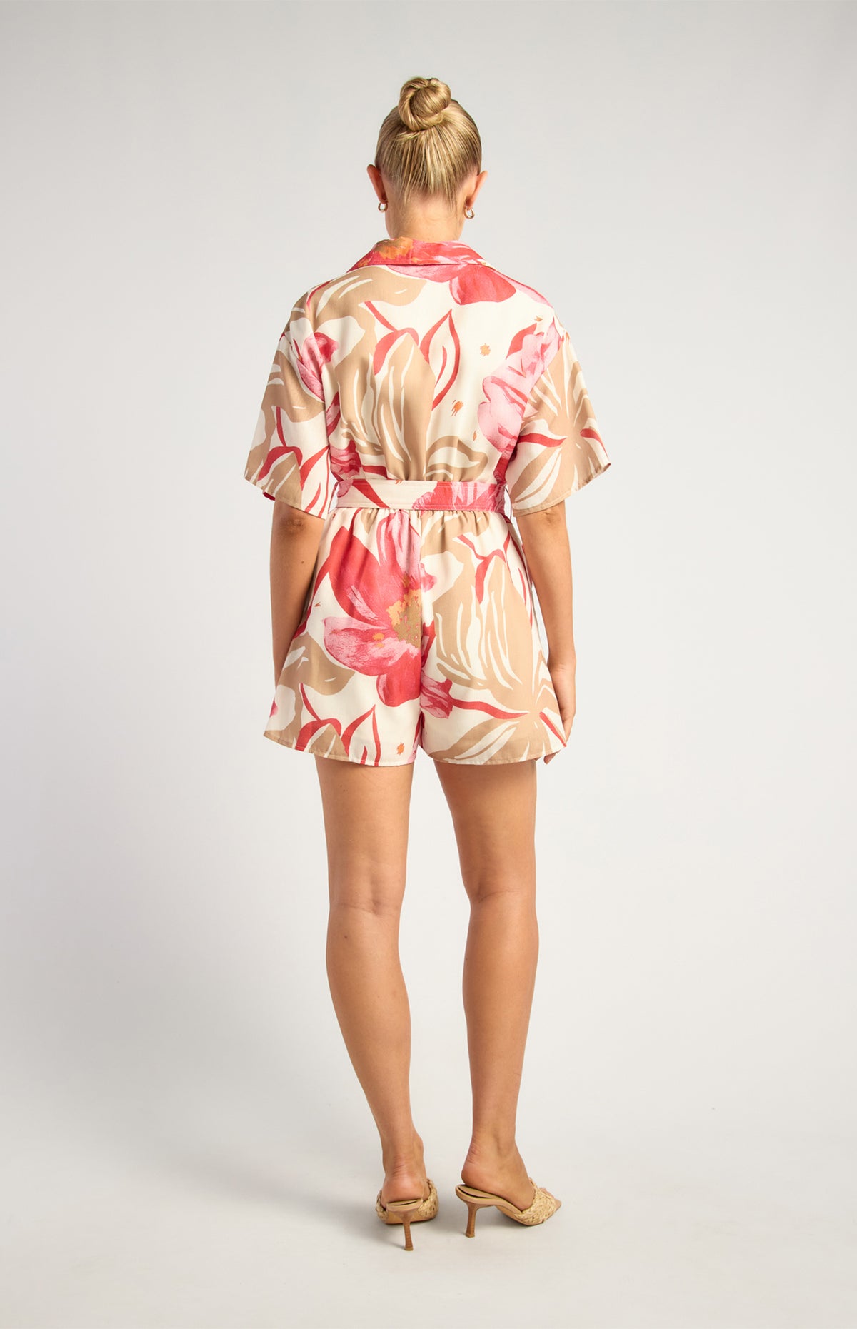 Back view showing the elasticated waist and shorts of the Red and Camel floral playsuit